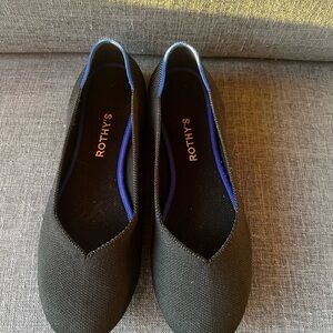 Rothy's Elegant Black Flats with Vibrant Blue Accent